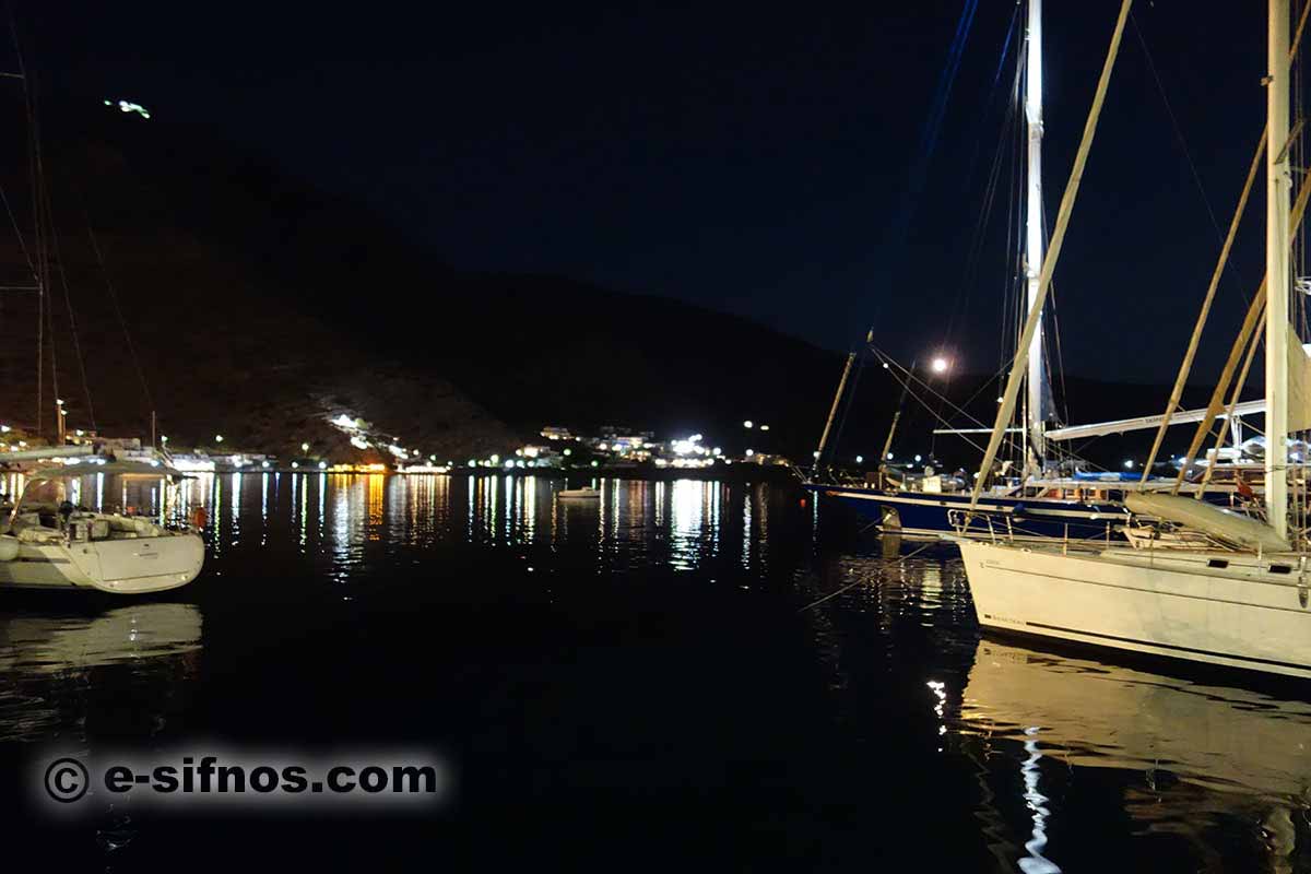 Night view of Kamares with sailing boats