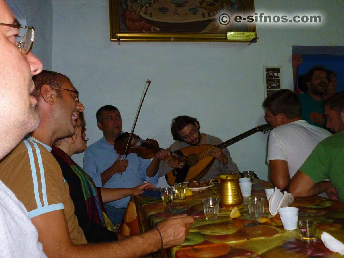 The violins play in the feast of Ai Gianis Mavro Horio and people sing
