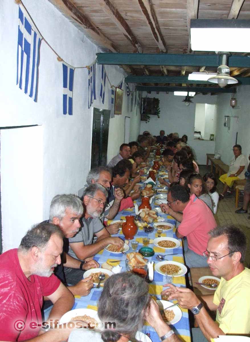 People eating chickpea soup at the feast of Panagia Tosso Nero