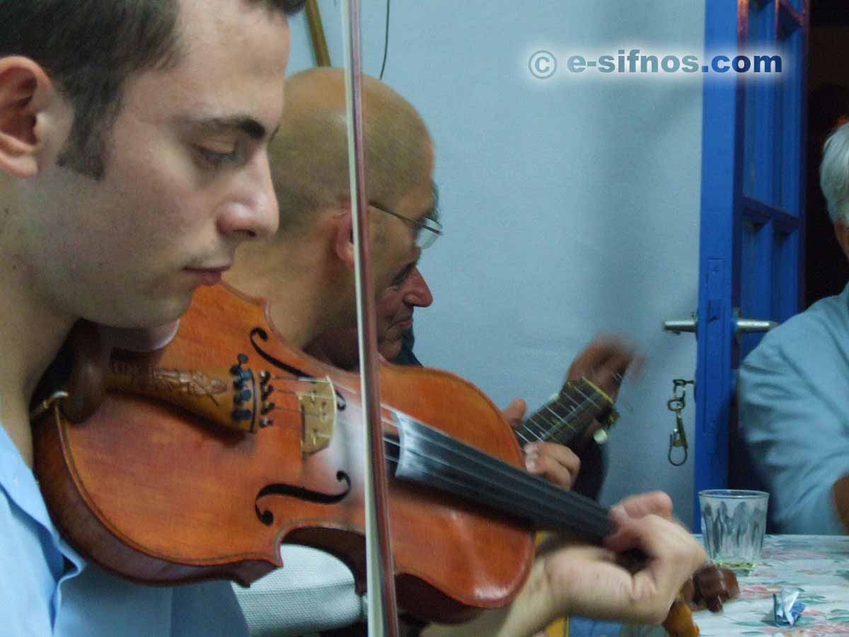 Traditional music players at a feast in Sifnos